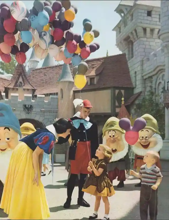 Kids with balloons- Disneyland, 1961