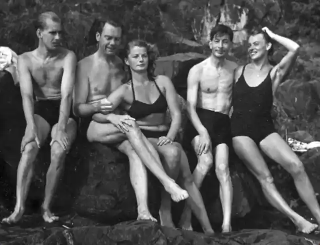 Couples sunbathing- 1940s