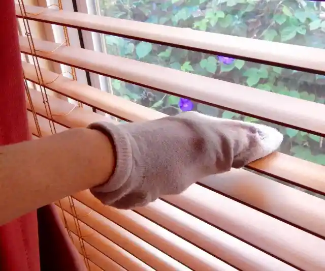 25. Use Soft Socks to Clean Your Blinds