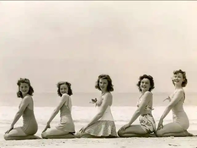 Friends posing on the beach- 1950s