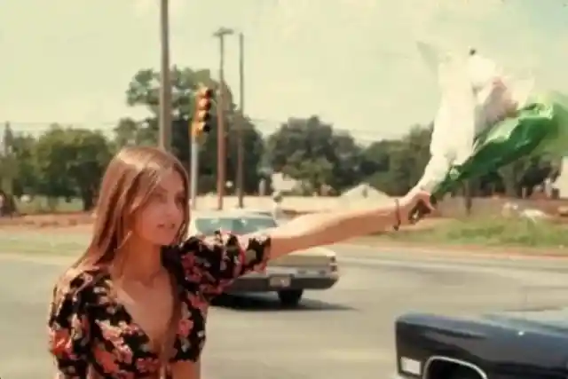 Hitchhiker with flowers- Oklahoma, 1973