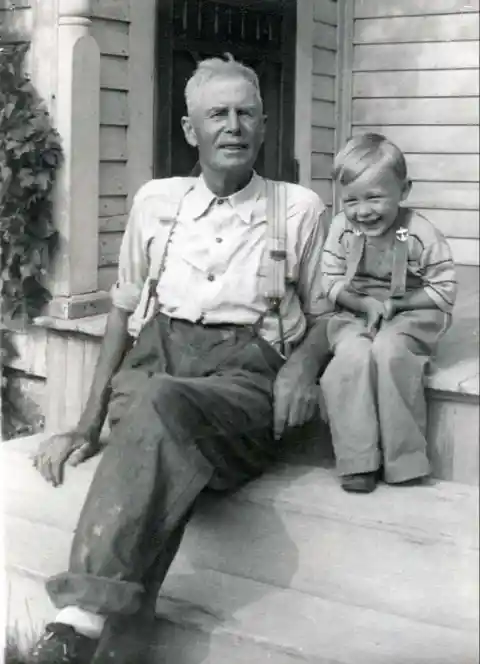 Father sitting with son- 1937