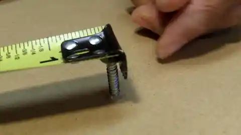 Metal And Black Diamond Markers On Measuring Tape