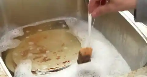 Adding a tea bag to a sink full of dirty dishes is such a simple trick!