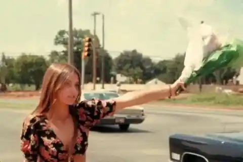 Hitchhiker with flowers- Oklahoma, 1973